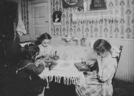 Girls working on ice wagon and delivering it in bags or sacks to homes 1912