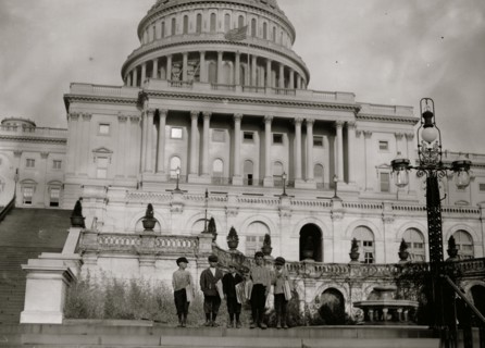Three Italian Newsboys on the steps of the Capitol Building in Washington, DC 1912