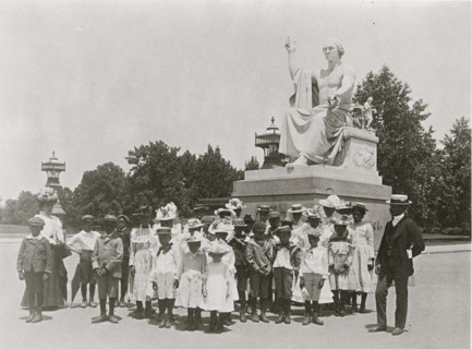 Group of school children in front of statue of George Washington, Washington, D.C. 1899