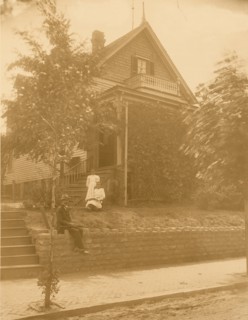 Home of an African American in Atlanta, Georgia, with man and two women in front of house 1899