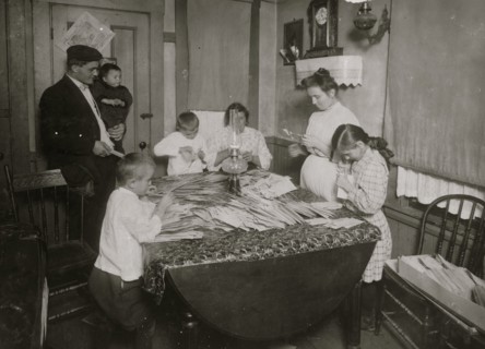 Home of Rufine Morini working on tags for Dennison. 1912