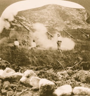 Japanese field battery firing shells over the mountains into doomed Port Arthur 1905