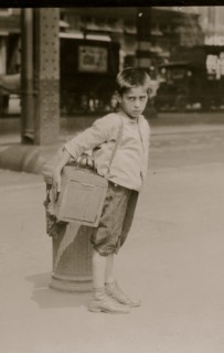 Jimmie, a seven year old bootblack, working on Canal Street, N.Y. City - July 25, 1924. 1924