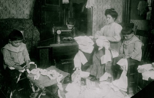 Making dresses for Campbell Kid Dolls in a dirty tenement room 1912