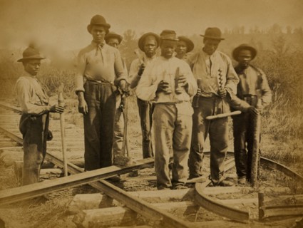Military railroad operations in northern Virginia: men standing on railroad track 1863