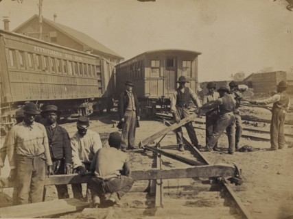 Military railroad operations in northern Virginia: men using levers for loosening rails 1863