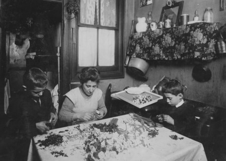 Mrs. A.L.A. She & her 3 children - 11, 9, & 6 yrs old work at flower making.  1924
