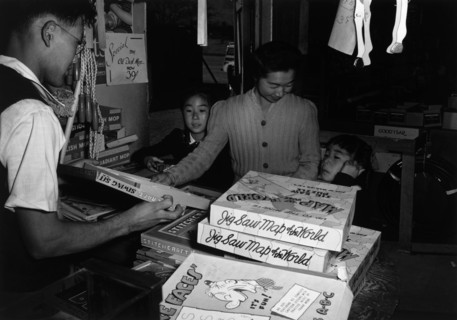 Mrs. Yaeko Nakamura and family buying toys with Fred Moriguchi 1943