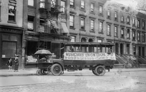 Musicians Union Truck parked by Hot Dog Vendor Cart sports large banner supporting the Transit Strike 1916