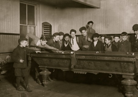 One way to control the street boys. A common scene in the Bancroft-Foote Boys Club, Playing Pool  1909