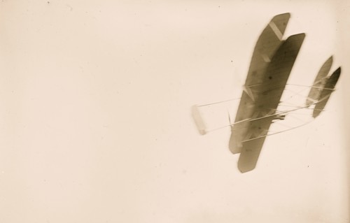 Orville Wright flying in his airplane 1908