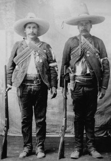 Pancho Villa's Men Urbino & Iluarte stand at attention with rifles, bandoliers and Pistols 1917