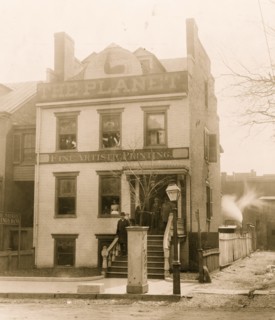 People posed on porch of and in the Planet newspaper publishing house, Richmond, Virginia 1900