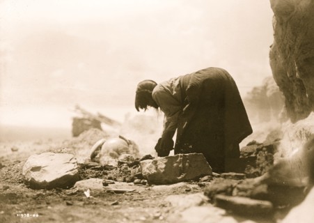 Potter building her kiln 1906