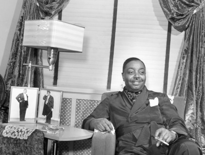 Prosperous Chicagoan spends evening at home. Chicago, Illinois 1941
