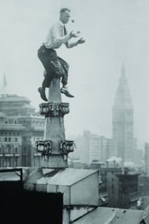 Reynolds Juggles balls on the Pinnacle of a roof  high above New York City