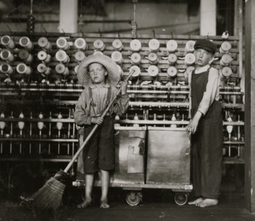 Ronald Webb, twelve year old doffer boy and Frank Robinson, seven year old who helps sweep and doff. 1911