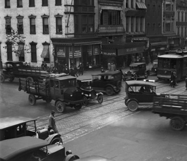 Street Corner in Washington DC with trucks park and growing traffic 1924
