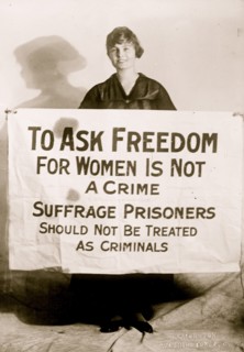 Suffragette Lucy Branham with Posters 1919