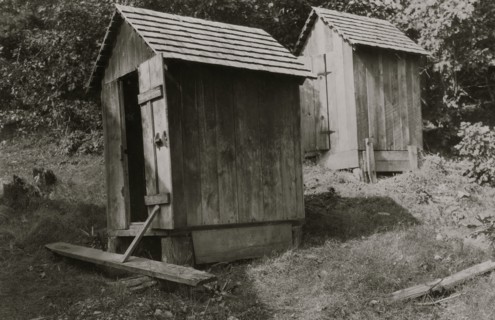 Sunset School - Showing bad location of toilets, - above the school and near together.  1921