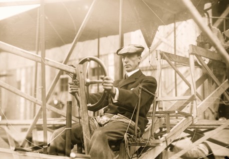 Dr. Wm. Greene at pilot wheel of aeroplane 1909