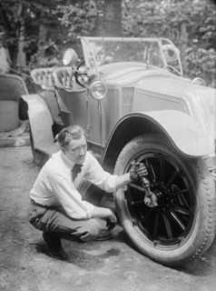 Thomas holds a wrench on the tire center nut