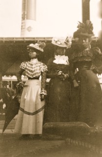 Three African American women, full-length portrait, standing, at the State Fair at Saint Paul, Minn. 1903