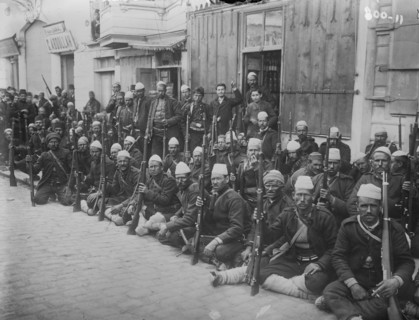 Turkish Infantry Unit Poses with their rifles and wearing Traditional Garb