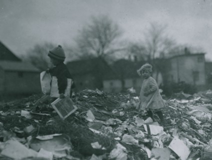 Two children going through the "Dumps." Location 1912