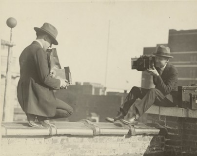 High Up Cameramen Shoot Each other