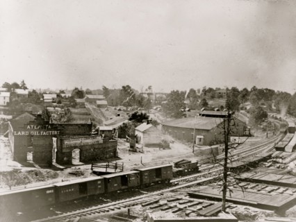 View of Atlanta, Georgia, with railroad cars in left foreground 1863