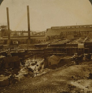 View over Village Deep Gold Mine, showing battery, tanks and shafts 1915