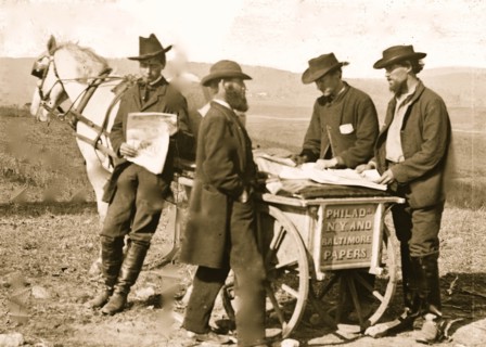 Newspaper vendor and cart in camp 1863