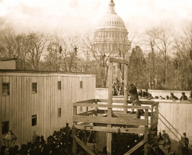 Washington, D.C. Soldier springing the trap; men in trees and Capitol dome beyond 1865