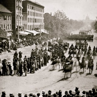 Washington, District of Columbia. The Grand Review of the Army. Gen. Henry W. Slocum (Army of Georgia) and staff passing on Pennsylvania Avenue near the Treasury 1865