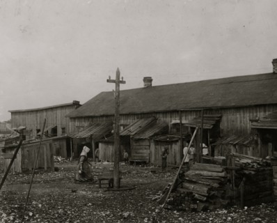 About 50 persons housed in this miserable row of dilapidated shacks located on an old shell-pile and partly surrounded by a tidal marsh.  1912