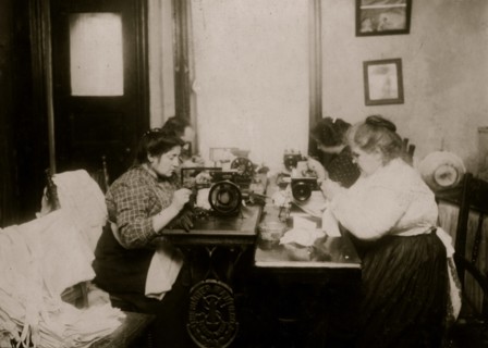 Workers on gloves, crowded into a small kitchen. Dallavalla, 50 McDougal St. 1912