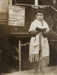 Jewish Boy in Prayer shawl and Sidur celebrates the Hebrew New Year