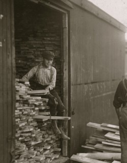 Young boy working for Hickok Lumber Co. Location: Burlington, Vermont. 1910