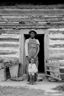 Young sharecropper and his first child 1939