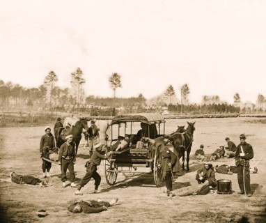 Zouave ambulance crew demonstrating removal of wounded soldiers from the field 1863