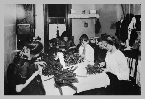 Family Sitting at Table Working with Garters 1900