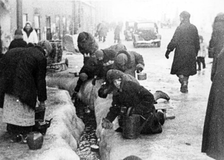 world war ll: the siege of leningrad, women taking water flowing from broken water mains.