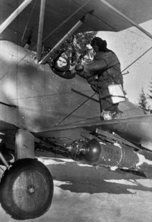 World war 2, soviet pilot preparing for a bombing run in a polikarpov po-2 (u-2) plane, ukraine.