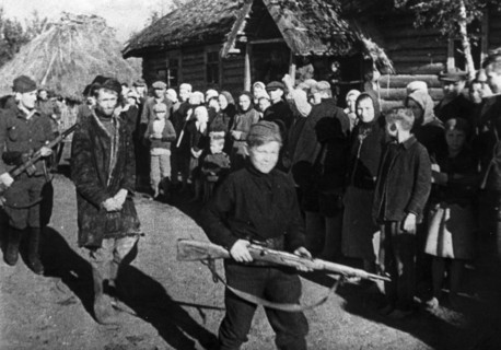 World war 2, a russian traitor being marched from the open air courtroom where he had been judged by the villagers, the procession is being led by a 13 year old guard, a full-fledged partisan scout, f...