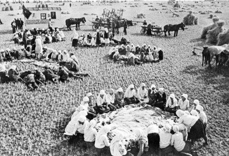 Dinner time during harvest season on a collective farm in russia, 1938.