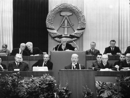 Walter ulbricht, state council chairman of the gdr, speaking on 'the constitution of the socialist society and its socialist state of the german nation' and gave his report as the chairman of the comm...