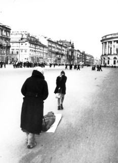 Victims of nazi bombing, taking a dead child to be buried during leningrad blockade, 1942.