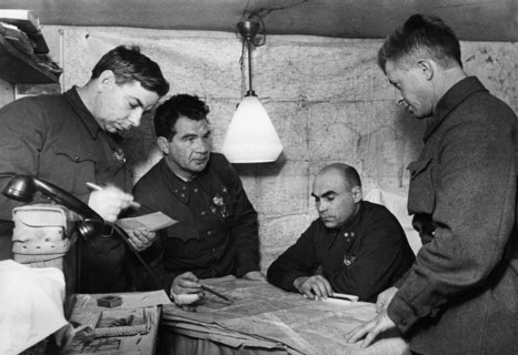 Lt, general vasili chuikov (2nd from left) giving an assignment to the commander of the 13th guards rifle division, major general alexander rodimtsev (far right), in the command post bunker of the 62n...