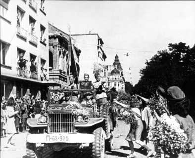 Soviet red army troops being greeted by citizens of sofia, bulgaria after being liberated from the germans in 1944.